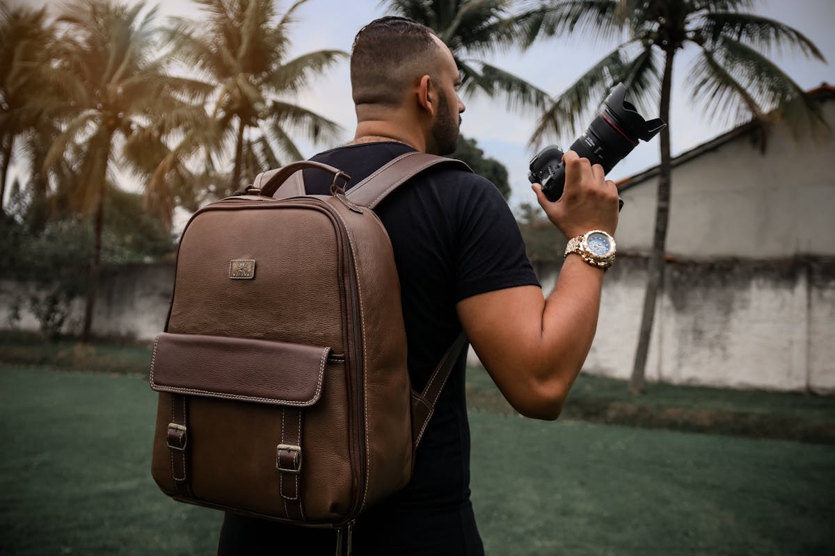 A Man with a Backpack and a Camera