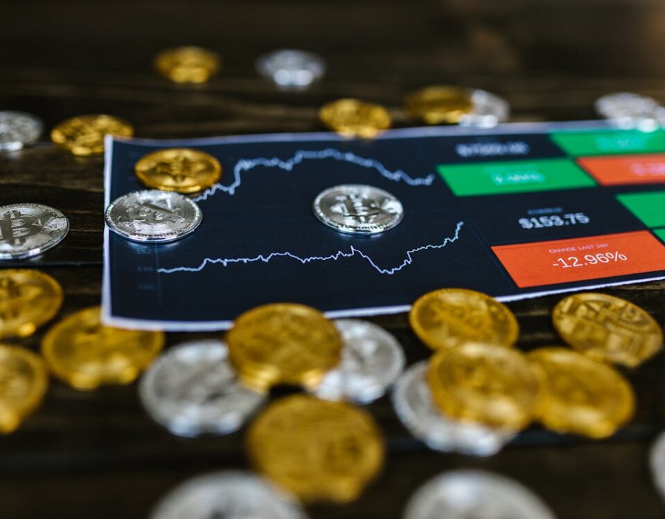 Selective Focus Photo of Silver and Gold Bitcoins