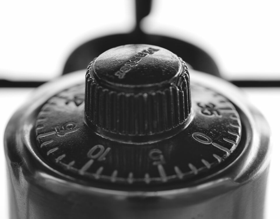 a close up of a black and white photo of a compass