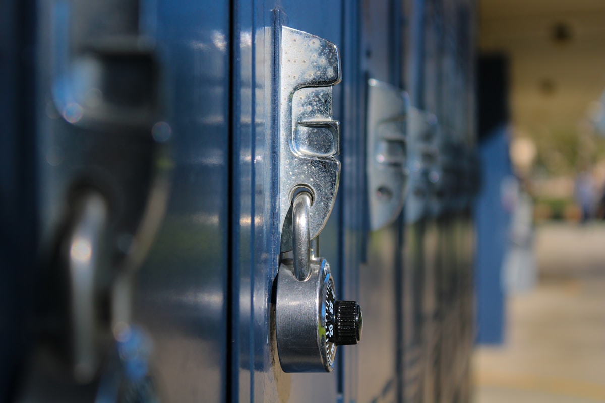 a close up of a door handle on a blue door