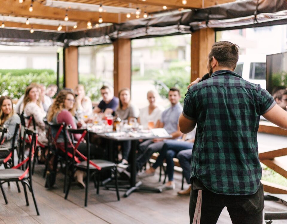 man standing infront of group of people