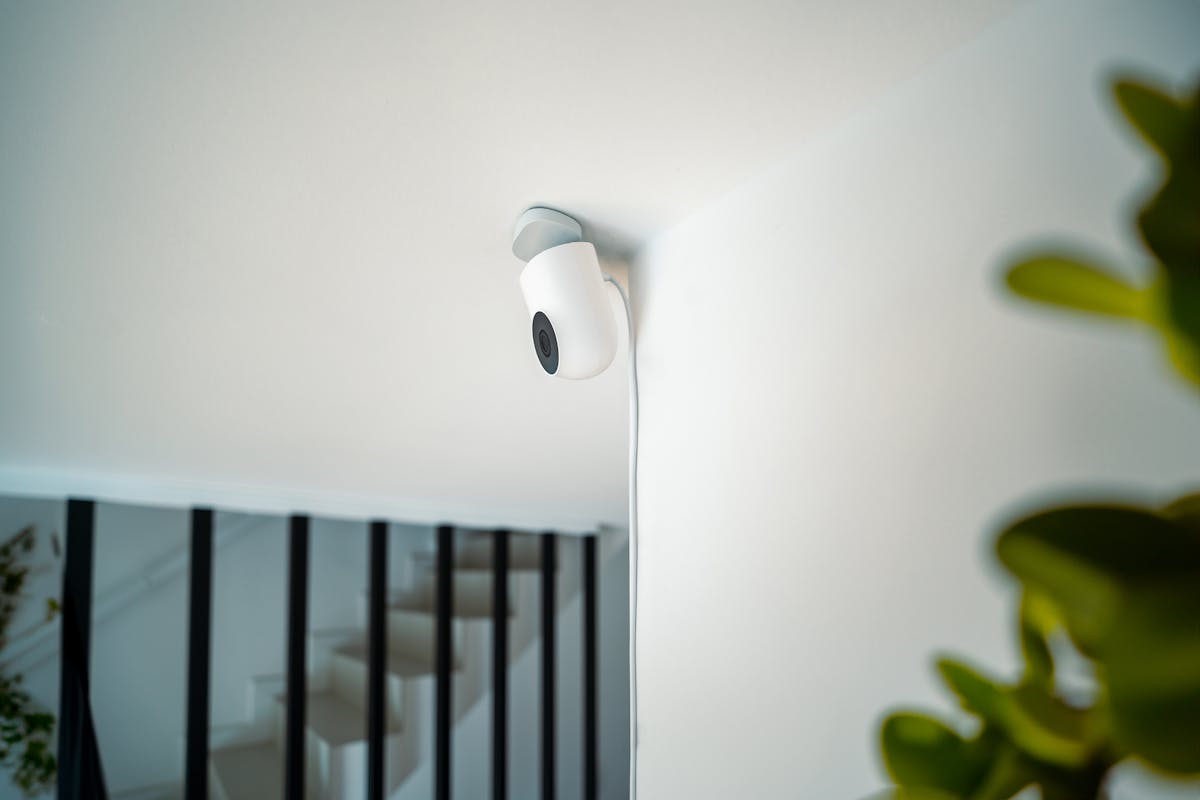 A sleek security camera installed indoors, demonstrating modern surveillance technology.